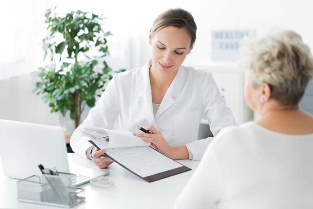 a doctor talking to a patient about beaverton oregon rehab centers
